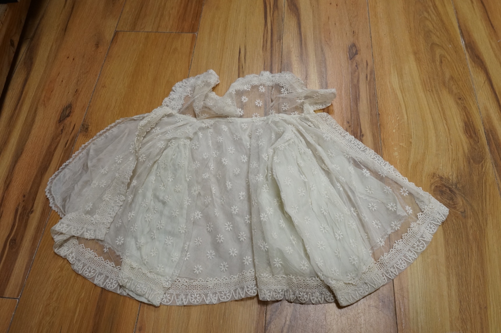 A collection Victorian textiles to include a lace christening gown, Irish crochet and a net baby gown